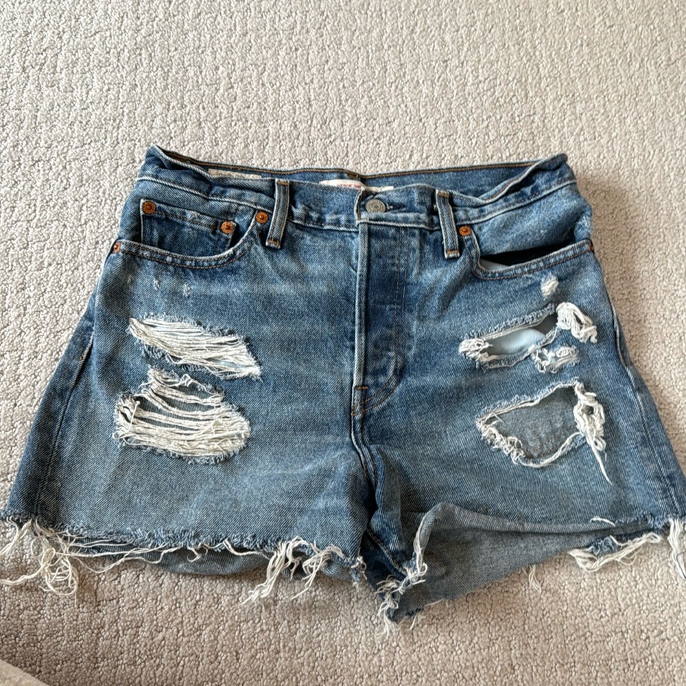 Levi's Wedgie denim cutoffs with rips
